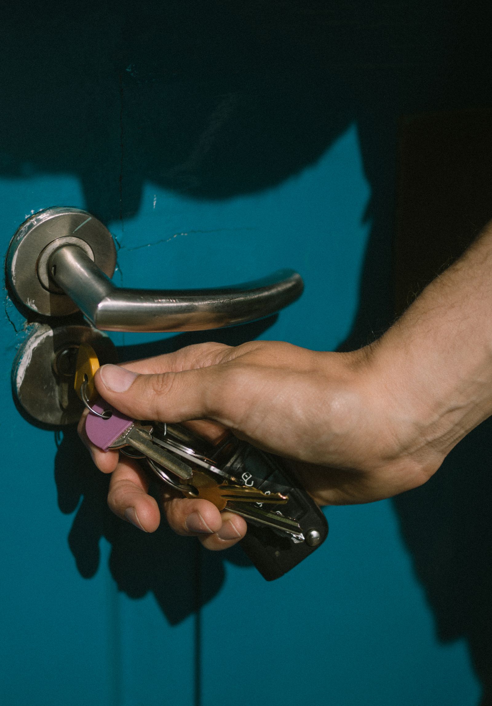 Locksmith working carefully on a residential door lock
